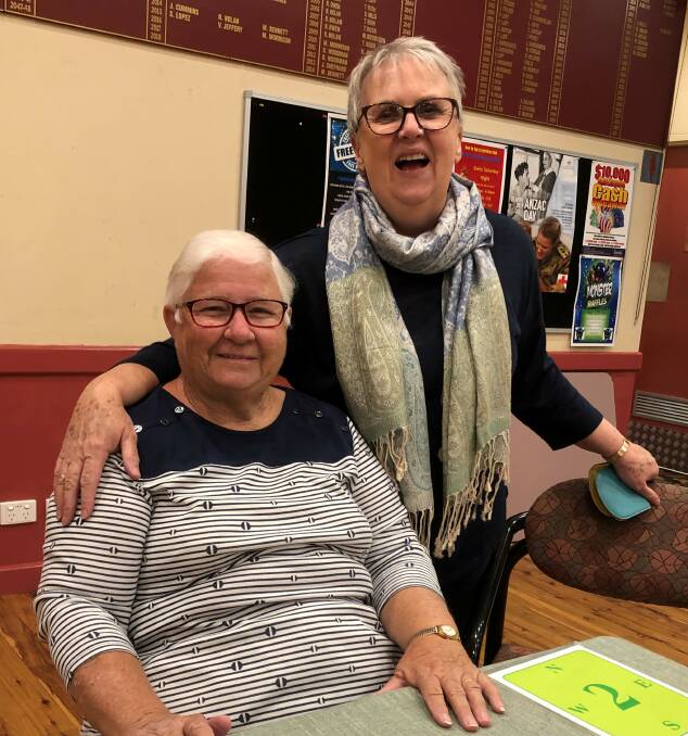 GOOD TIMES: Joyce Meale (seated) and Ruth McCarthy enjoy their time at bridge. Cootamundra Bridge Club wishes all a safe and happy Easter. Picture: Contributed
