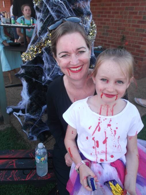 DEVILISH DUO: Cassie and Amelia Smith support CADAS Kids by dressing up recently. Pictures: Contributed