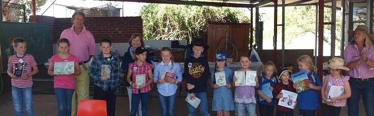 PROUD MOMENT: Prize winners from the “Poucher and Big Guy’ story writing competition as part of the Jugiong Writers' Festival. 
