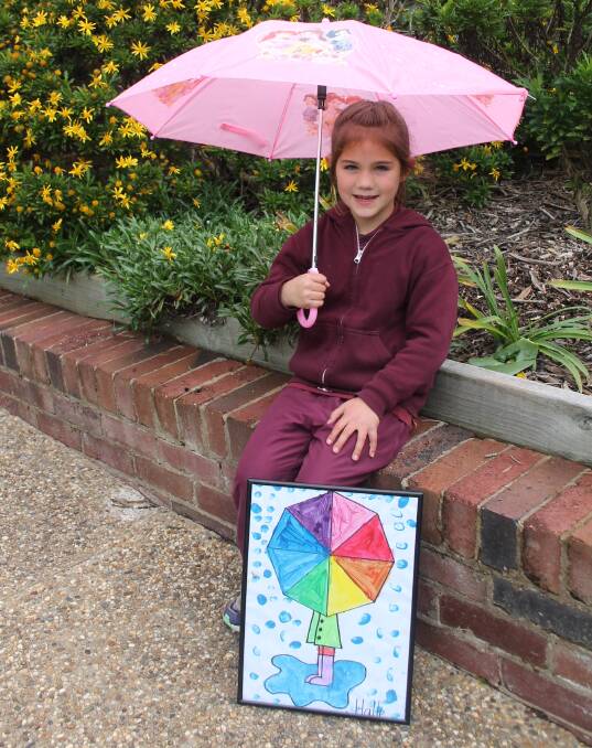 INSPIRED: Halle Nicka with her Artist of the Month winning painting created in her year one class at EA Southee Public School. Picture: Jennette Lees 