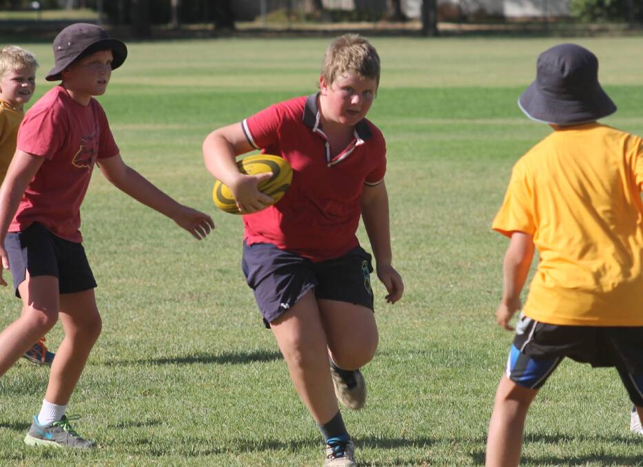 FLASHBACK: Harry Watson finds space during junior touch back in 2014. This Wednesday, February 15, there will be a come and try day at Nicholson Park.