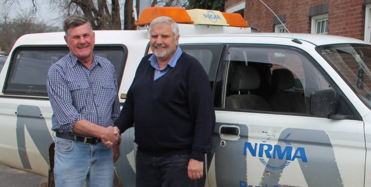 COLLEAGUES AND FRIENDS: John Chambers (right) bids Paul Basham thank you and good luck as he retires following 36 years in the SG Chambers workshop and NRMA vehicle. Picture: Jennette Lees 