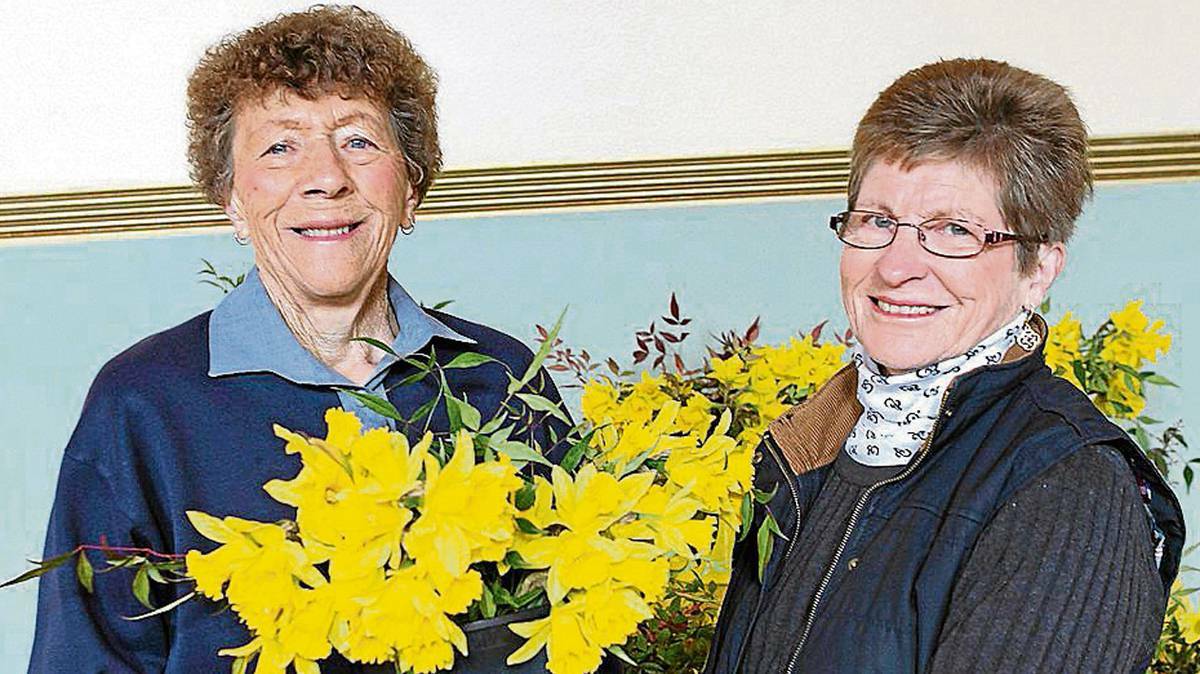 BEAUTIFUL BLOOMS: Pictured at a recent Daffodil Tea were Fay Golden (left) and Belinda Scott.