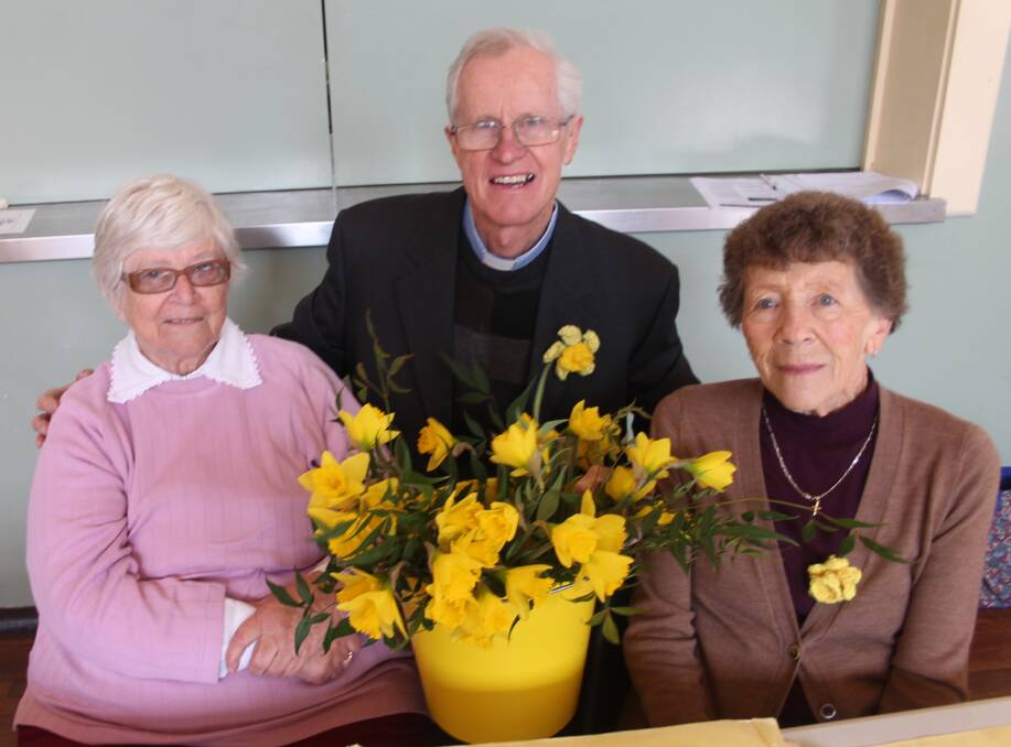 Judith Fleischer, Reverand Rob Donald and Fay Golden helping out at the Daffodil Tea last year. 
