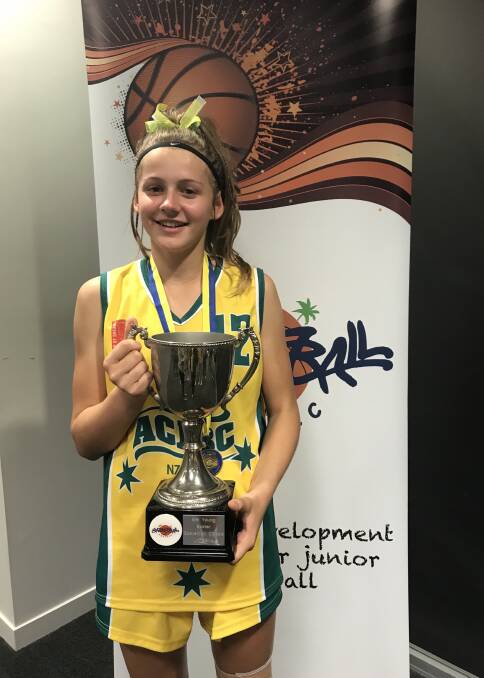 TOP SPORTSPERSON: Still a teenager but with a swag of medals in various sports at all levels under her belt, Samantha Graham was recently named '2019 Frank Smith Memorial Sportsperson of the Year' by the Cootamundra Sports Foundation. She is pictured with the trophy following her team's success in the 'Basketball Pacific Mel Young Easter Classic' in New Zealand in 2019. 