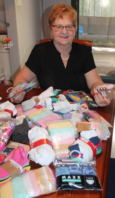 Janette Harris with some of the underwear and socks already donated or purchased to go to Westmead Hospital. Picture: Jennette Lees 