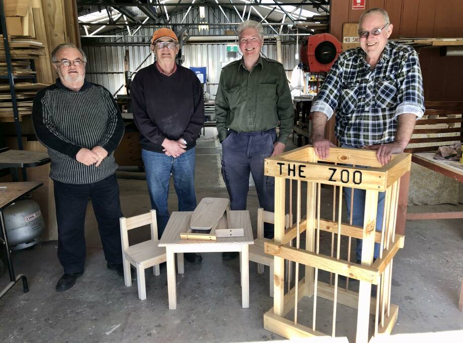 With just a couple of the plethora of wooden gifts being made by Cootamundra Men's Shed members are (from left) Richard Cairns, Bryan Gawthrop, John Paag and Andy Pickette. Picture: Jennette Lees 