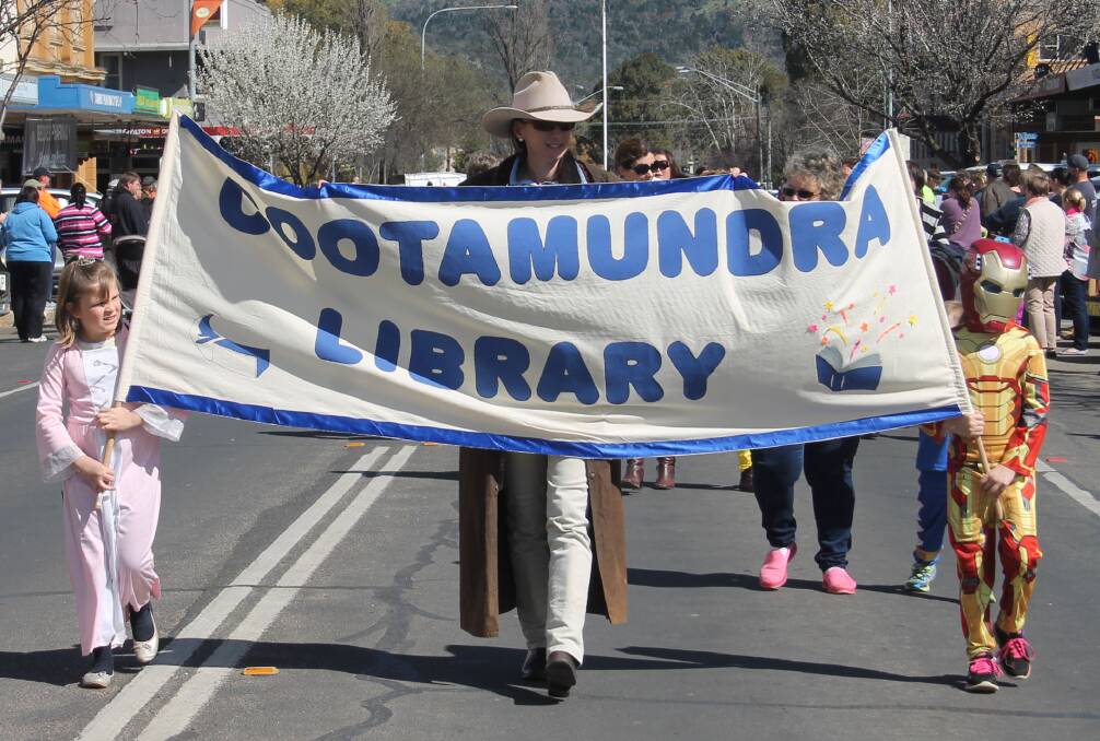 GREAT TIME: Cootamundra Library representatives make their way down the main street as part of last year's Book Parade. Picture: Jennette Lees  
