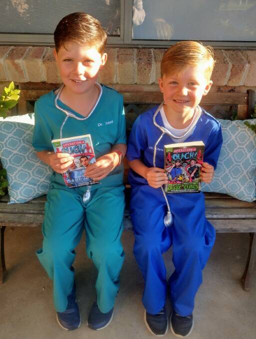 GREAT COSTUMES BOYS: Xander (8) and Benny (7) Moon dressed as the twin doctors Dr Xand and Dr Chris from the 'Operation Ouch' books for this year's Book Parade, held in individual schools and pre-schools this year rather than the traditional march down Parker Street. Picture: Tracey Moon