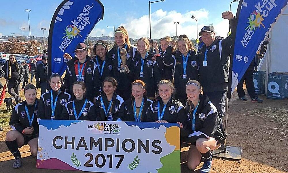 WINNERS ARE GRINNERS: Wagga City Wanderers under 14 girls celebrate their Kanga Cup triumph in Canberra on Friday. Picture: Wagga City Wanderers. 