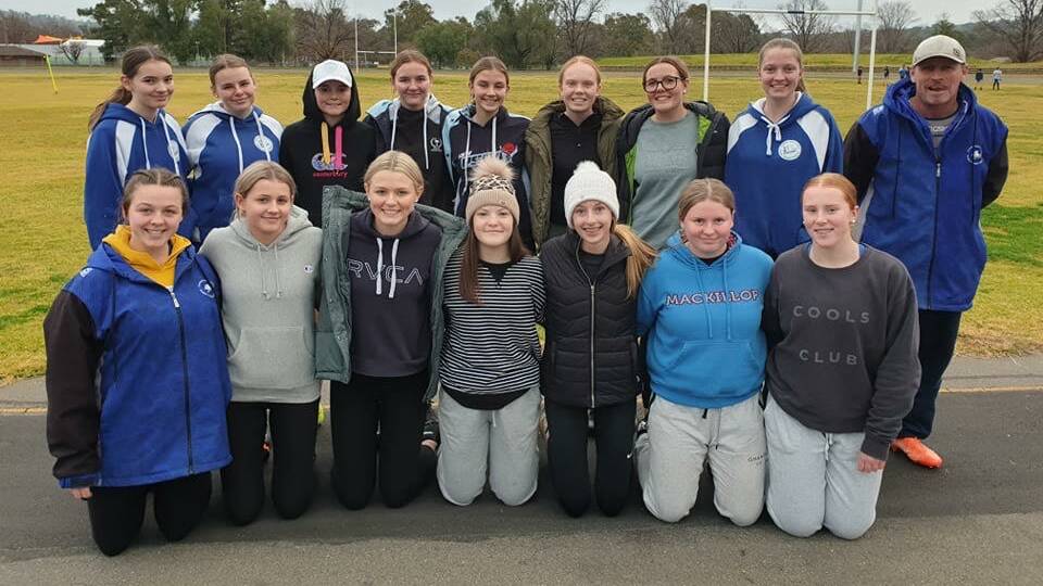 FINAL SEASON: Coach John Murray with his under 16 league tag charges. The girls are in their final year with the junior club making the resumption of the season extra special to them. 
