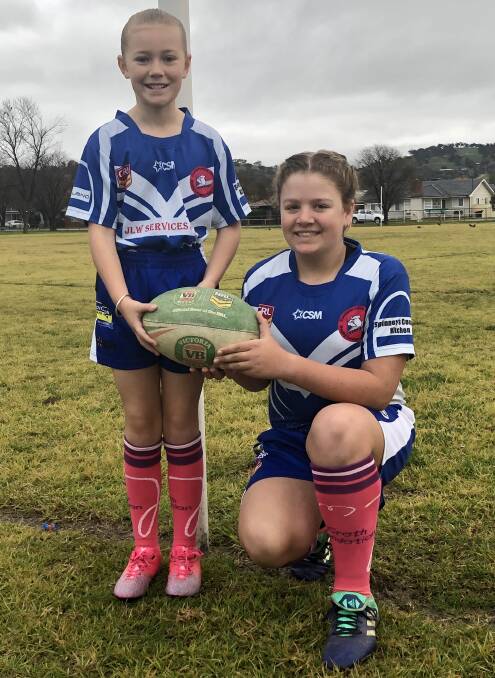 SUPPORTING TOP CAUSE: League-taggers Lucy Paterson and Zoe Beath sport their McGrath Foundation pink socks ahead of Saturday's charity round. Picture: Jennette Lees