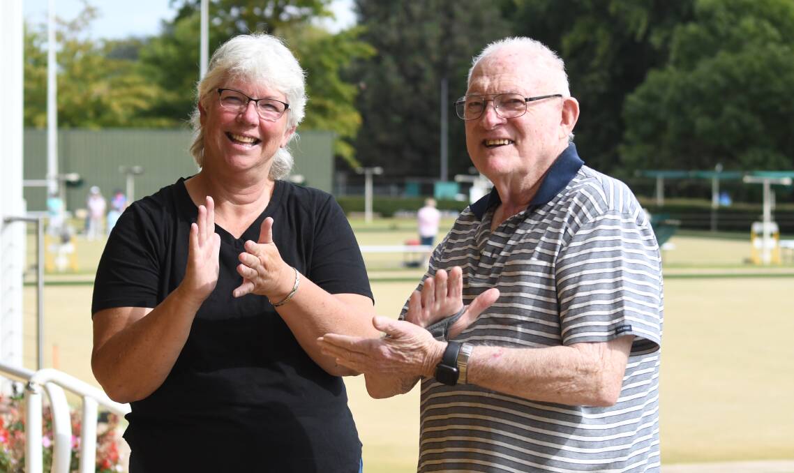 GREAT NEWS: Wendy Daley and Tony Gorringe using the sign for happy to describe the news that Auslan would be introduced into schools. Photo: JUDE KEOGH.