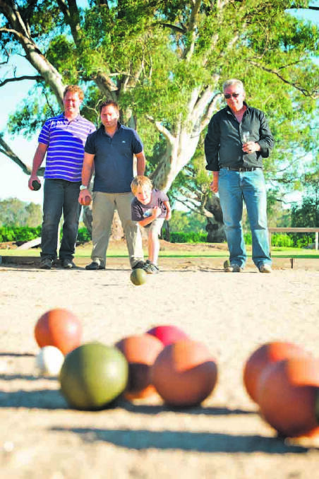Michael, Christian and Otto Dal Zotto playing bocce Michael, Christian and Otto Dal Zotto playing bocce