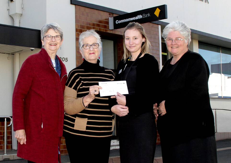 DONATION: CanAssist secretary Gloria Harris, Cootamundra Commonwealth Bank branch manager Hollie Hawkins, CanAssist president Bev Withers and Jenny Farish, customer service.