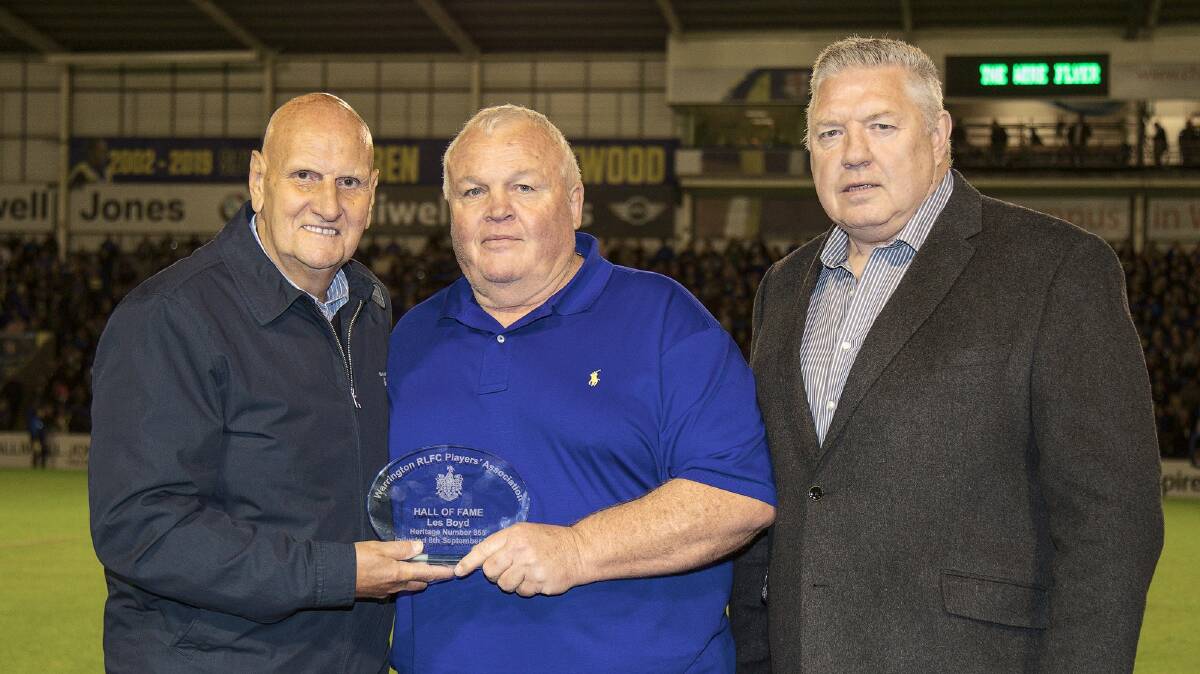 Les Boyd (middle) pictured with Warrington Wolves club officials and former players. Photo by Warrington Wolves - Facebook