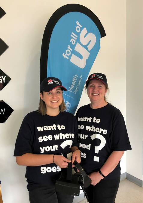 TEAM: NSW Health Pathology technical assistant Olivia Fisher joined pathology laboratory’s supervising scientist Rebecca Perry to show visitors and patients a virtual reality video at Cootamundra Hospital for International Pathology Day. Picture: Kellie Hancock