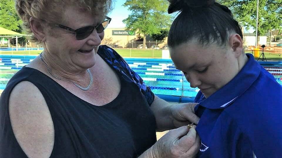 Cootamundra Swimming Lifesaving Club life member Sue Parkinson presented the club captaincy pin to Abbey Gammon who was named club captain for season 2018/2019.