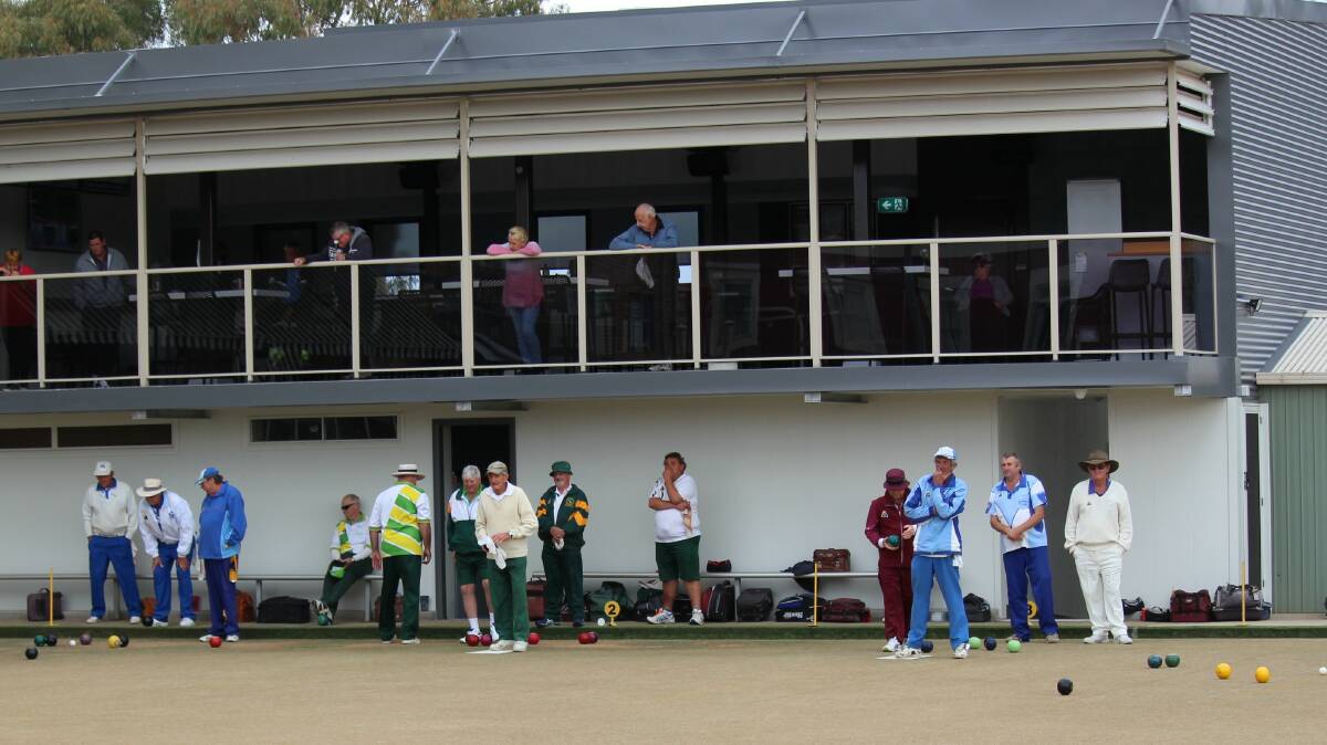 ON A ROLL: Players and spectators take in the bowls action at Cootamundra Ex-Services Club. Picture: Supplied
