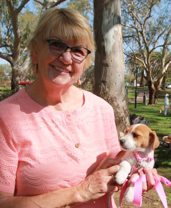 Anne Hamilton with three-week-old pup Bella.