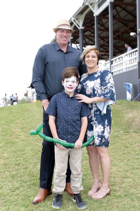 Mick and Alana Simons with son Harry, who enjoyed having his face done by the CADAS Kids.