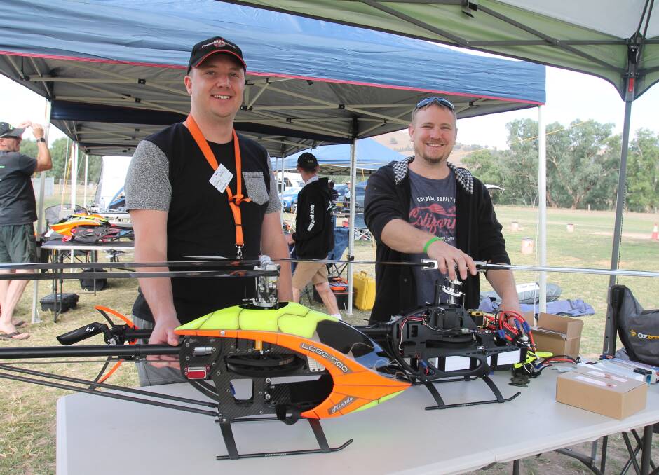 Paul McCarthy (left) and brother Ryan, from Melbourne and Perth respectively, with their Mikados, one without canopy. The batteries give four minutes' flying time. 