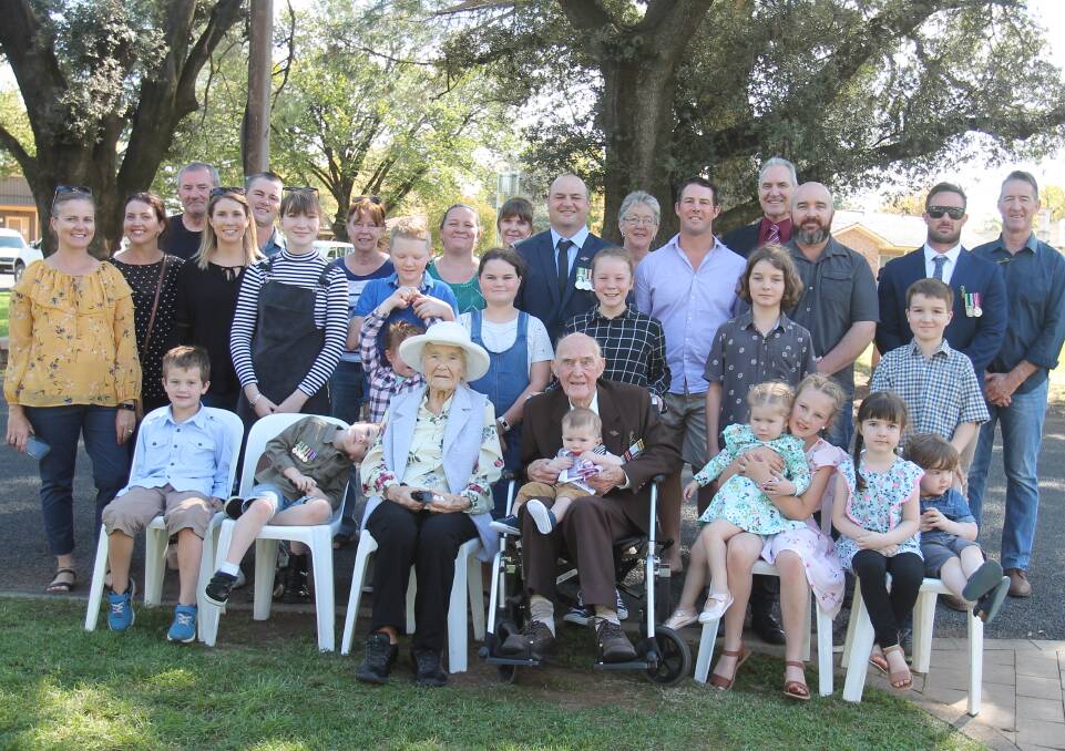 BIG DAY: Ted and Alison Fergus, with their family at Albert Park. Grandson Trevor Miller (back row, centre), son Michael Fergus (fourth from right) and grandson Ty Fergus (second from right) were with Ted in the march. 
