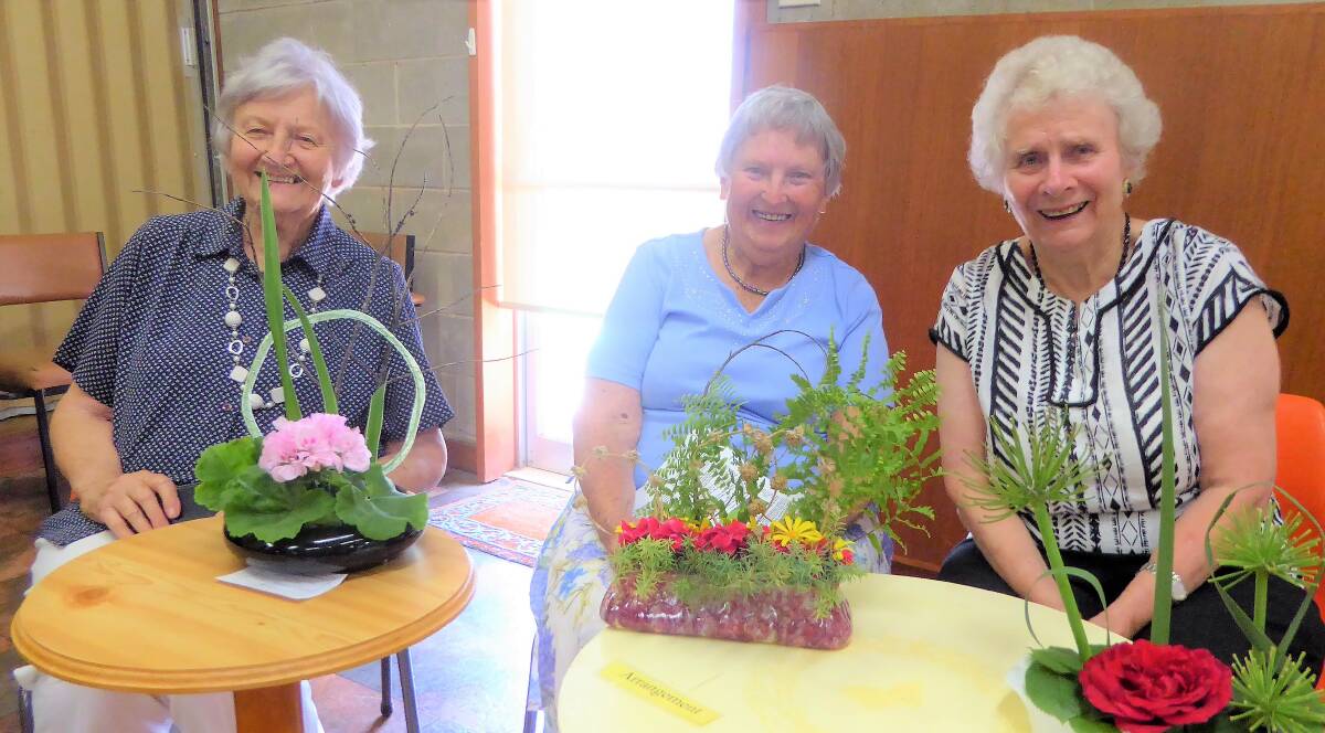Well done to Norma Clarke (left), Joyce Orgill (centre) and Elaine Cooper (right) who created these floral interpretations of lines and circles.