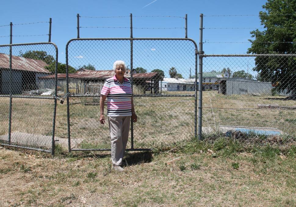 Mrs Hamilton at the Murray St. gate yesterday. The government portal says the 3,800 sqm is zoned "commercial core" and "medium density residential".