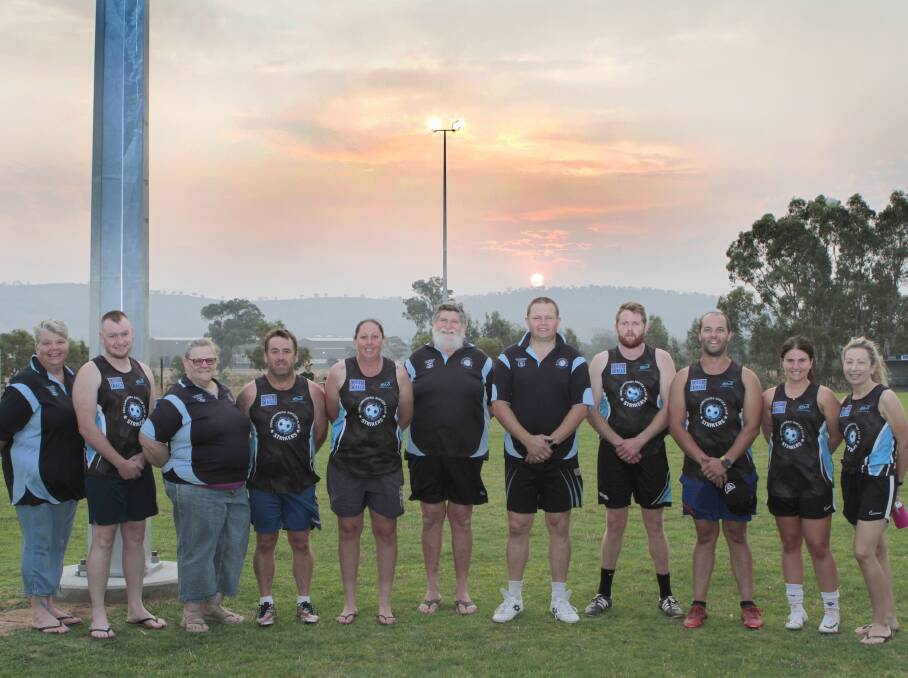 Lights, camera, sunset: Cootamundra Strikers Soccer Club 2020 committee, coaches and managers. Picture: Kelly Manwaring.