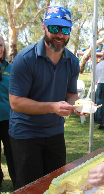 Andre Sannazzaro about to enjoy a slice of Australia Day cream sponge.