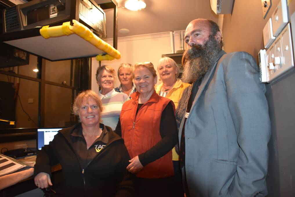 Opened: Cr Stewart (right) being shown the new digital projection system by TACC people Julie Cowell, Lindsey Baber, Leigh Scott, Anne Steinke and Isabel Scott.
