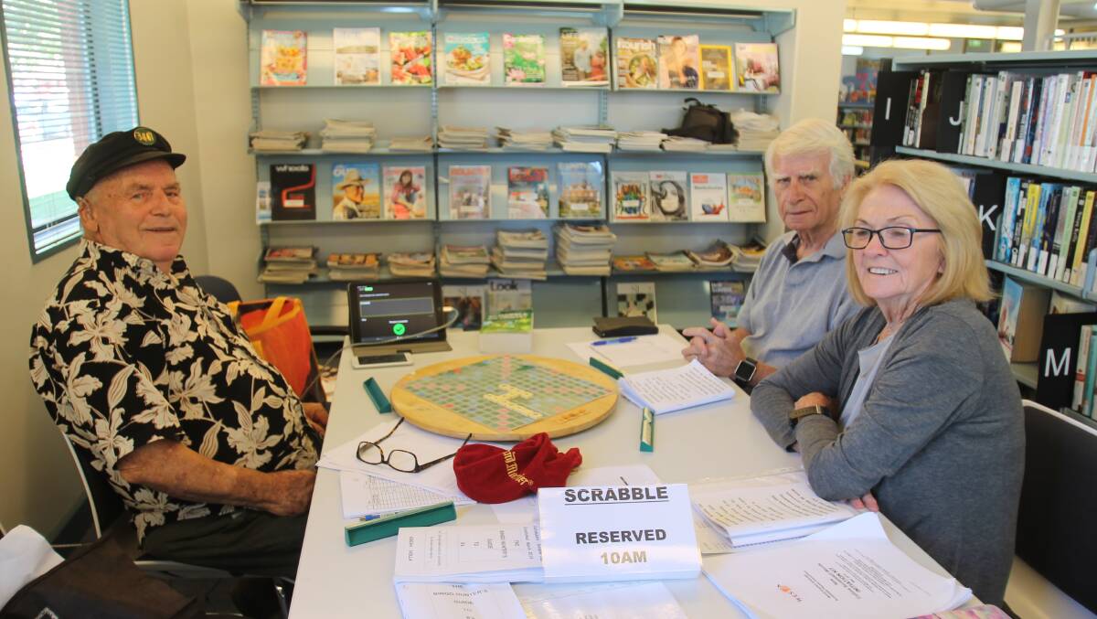 Arie Holla with Glenn and Pat Richardson at Cootamundra Library's Tuesday morning Social chess and Scrabble.