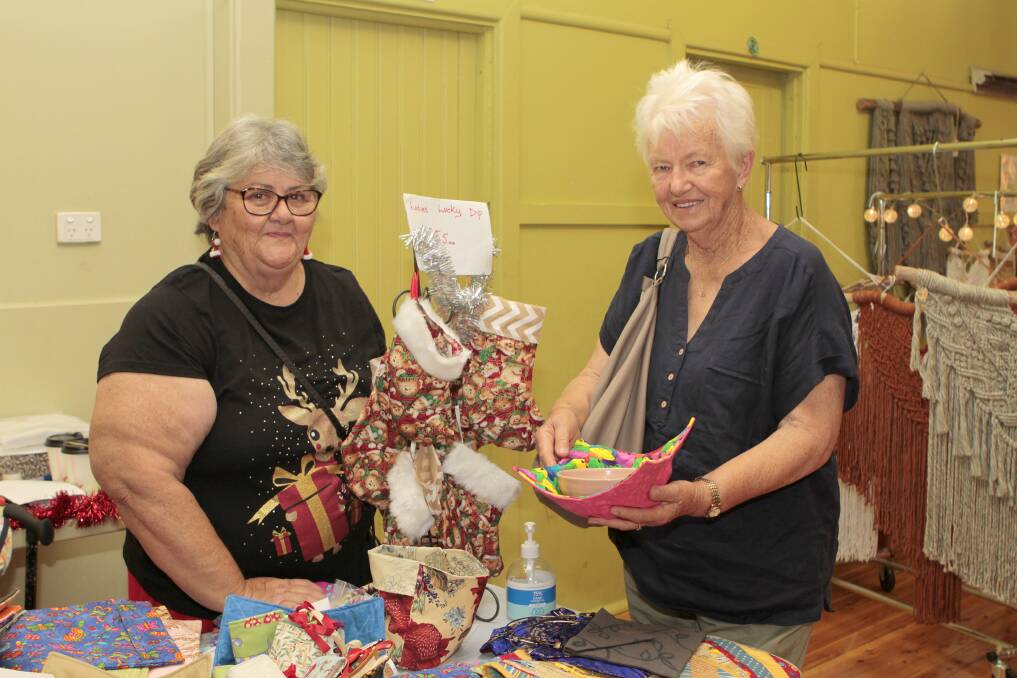 Cathy O'Brien manning her stall Cathy's Crafts with customer Enid Coddington of Temora.