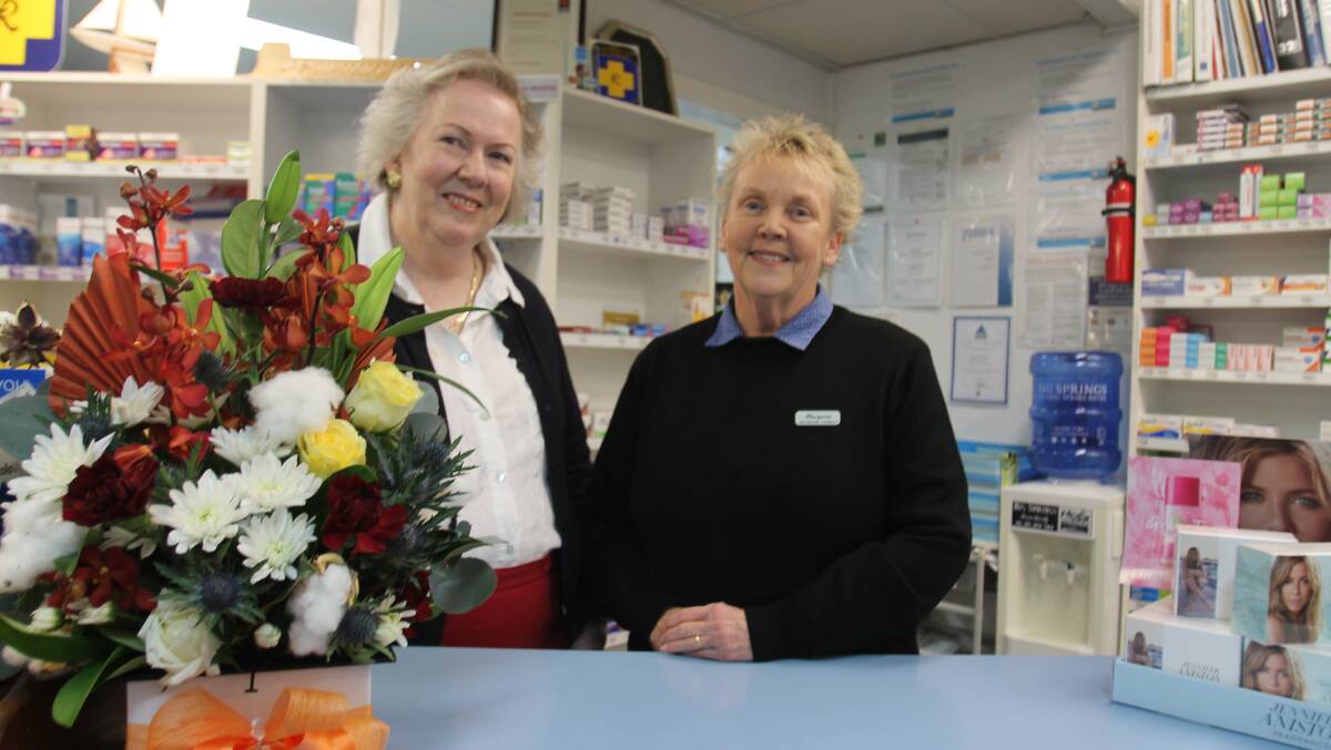 Margaret Nixon (right) and Judy Braybrook at the counter where Margaret has served thousands of customers.