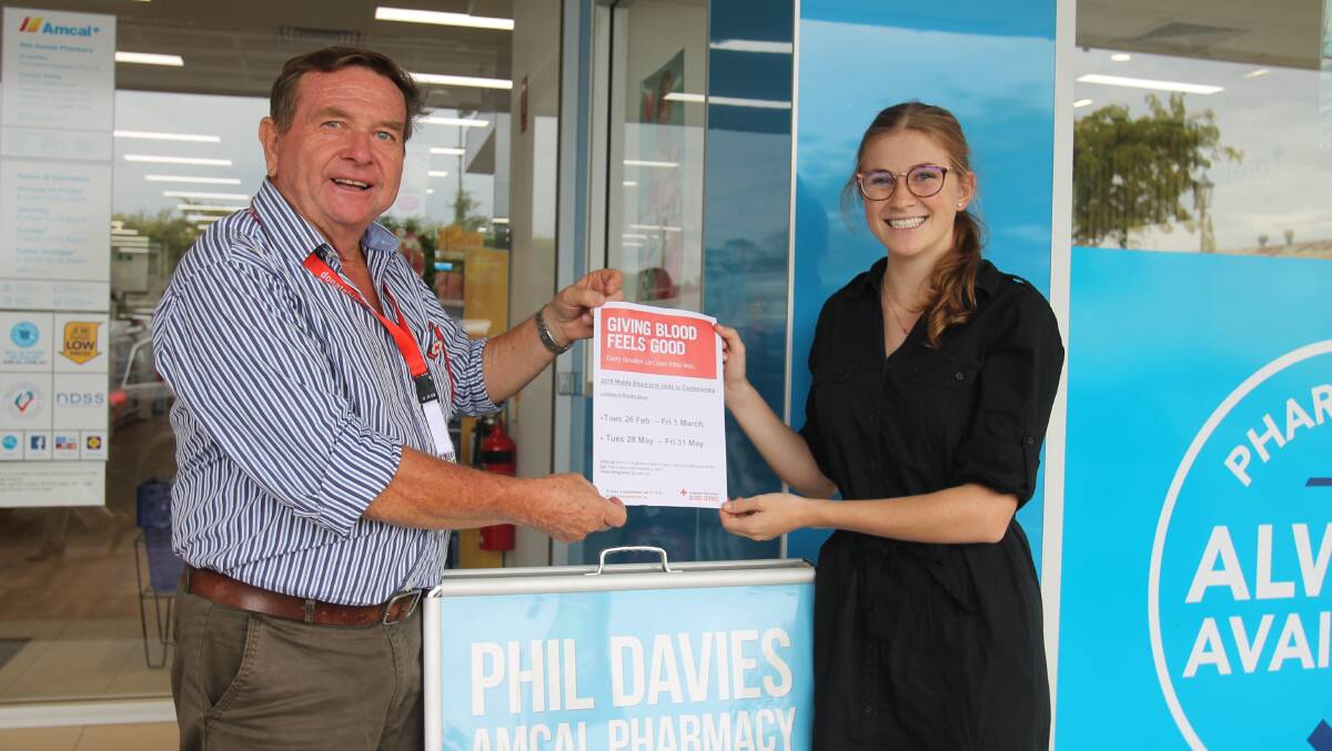 Jim Griffiths with Kate Alderman at Phil Davies Amcal Pharmacy. Posters have gone up around local businesses announcing a visit by the mobile blood unit from 26 February.