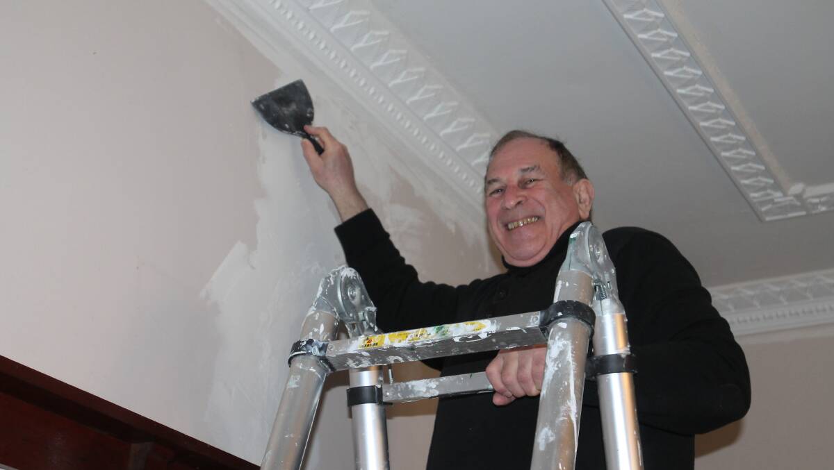 DIY professor: Gary Lilienthal has spent a lot of time up a ladder doing "25 years worth of maintenance" in a year, especially treating ceiling and wall cracks with flexible filler. 