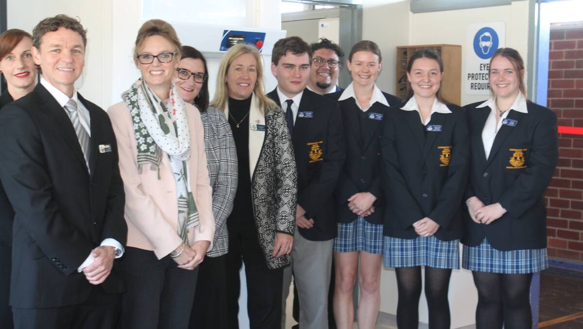 (From left) P&C representative Kate Holt, Alasdair Sides, head science teacher, Steph Cooke, MP for Cootamundra, Sarah Mitchell, minister for education and early childhood, and Leesa Daly, principal, Peter Beath, Wiradjuri man and former school captain, and students Mathew Friend, Michaela Webb, Brianna Hefren, Eliza Cooper.