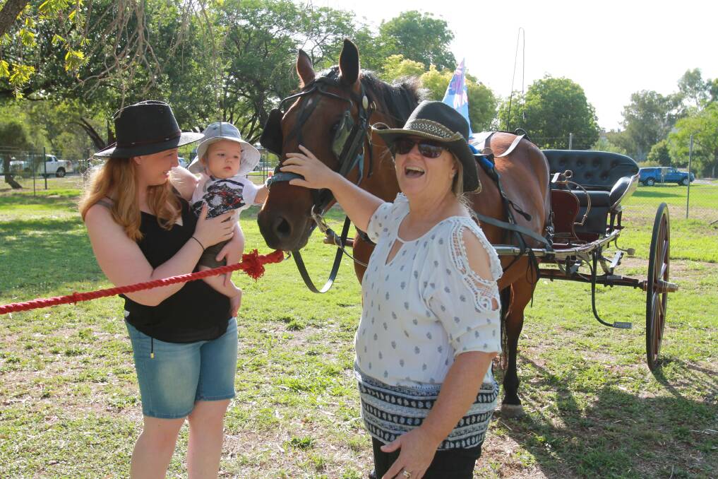 Learning: Baby Oliver Barrett learns what it feels like to pat a horse, with mum and grandma Hannah and Julie Hodge and horse Pee Wee Tom.