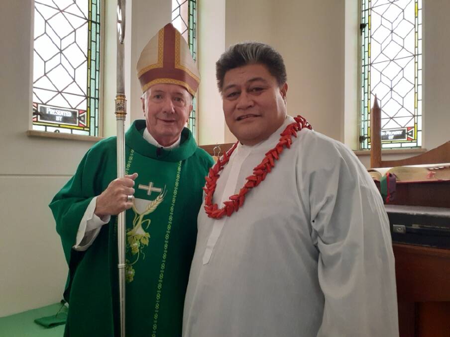 Father Gisa at his induction, with Archbishop Christopher Prowse. He replaces Father Joshie, who has moved to Goulburn.