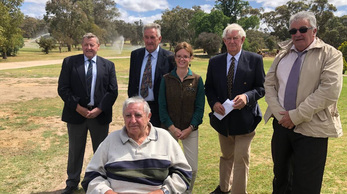 After the sprinklers started, Wiradjuri elder Bob Granville in the foreground with mayor Abb McAlister, deputy mayor Dennis Palmer, MP Steph Cooke, project manager Simon Bragg and club chairman John O'Loughlin.