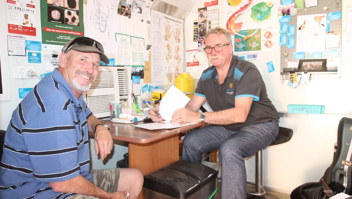 Cootamundra's John Welsh with registered nurse Rob Woolley.