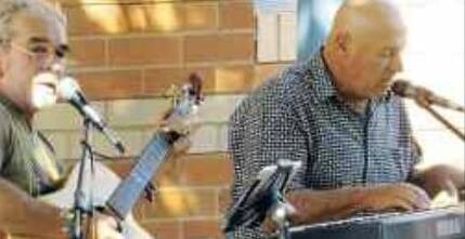 Trevor Champion, guitar, and Bill Robertson, keyboard, playing to a "very receptive"
audience at a previous concert at the Library. They are looking forward to appearing in Coota again.