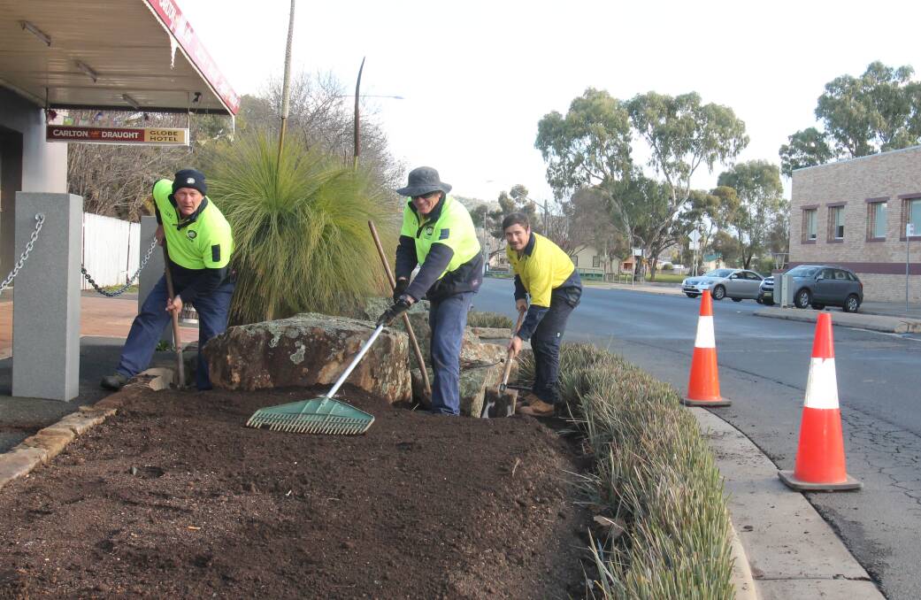 Council workers Graham McCallum, Mark Basham and Will Debelin pictured this week renewing the garden beds at the Parker/Wallendoon roundabout.