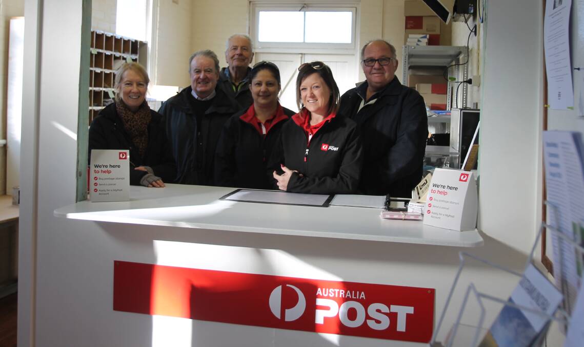 Achievement: On hand on Monday morning when the post office opened its doors in the hall, (from left) Kim Knox-Thurn, Greg Quirk, Brian Sims, Perin Pertev and Deanne Vaughan of Australia Post, and David Jacobs. 