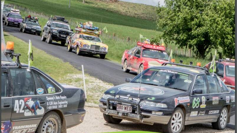 A convoy of decorated cars in the Camp Quality esCarpade.