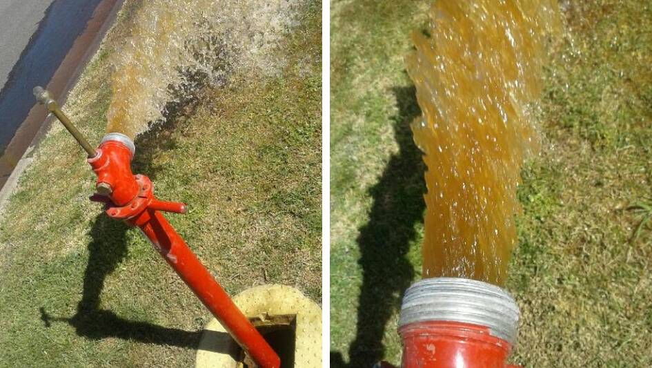 FLOW: Discoloured water from a hydrant connected to Cootamundra's water mains. Contractors for Cootamundra-Gundagai Regional Council have started work to replace the pipes.