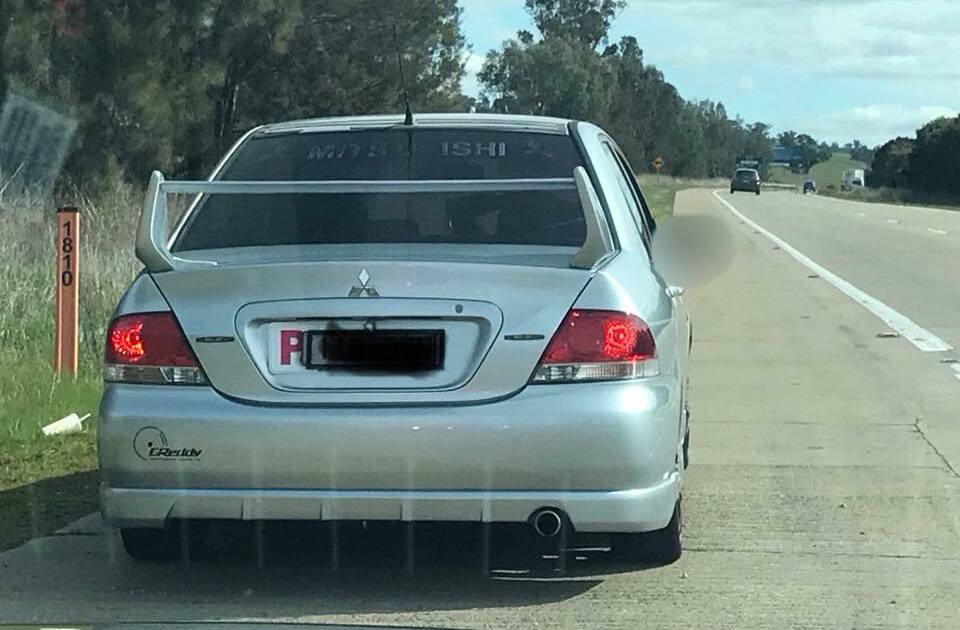STOPPED: The silver Mitsubishi caught for exceeding the P1 speed limit by more than 45km/h on the Hume Highway on Monday. Picture: NSW Police