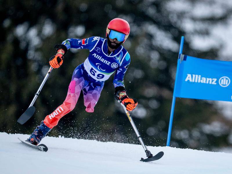 Ralf Etienne has made history by becoming Haiti's first winter Paralympian at Milan-Cortina. Photo: AP PHOTO