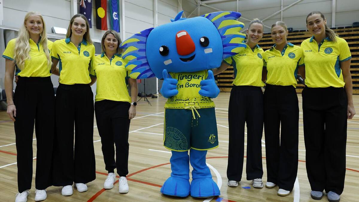 Coach Stacey Marinkovich (third left) and some of the Diamonds squad with Games mascot Borobi. (Con Chronis/AAP PHOTOS) Coach Stacey Marinkovich (third left) and some of the Diamonds squad with Games mascot Borobi. (Con Chronis/AAP PHOTOS)